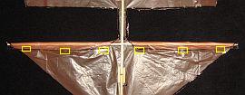 The 1-Skewer Roller - attaching the leading edge of the lower sail The 1-Skewer Roller - attaching the leading edge of the lower sail