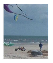 A kite buggy on the beach. A kite buggy on the beach.
