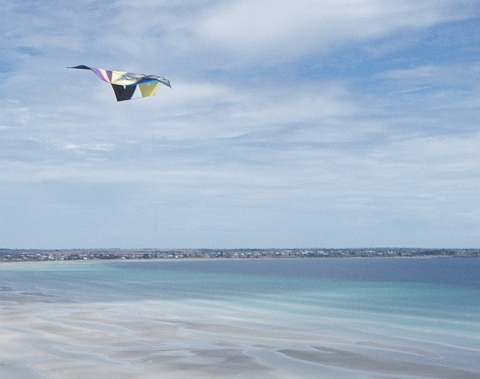 Air to air shot of a kite at the Sandbar Golf Classic and Family Fun Day.