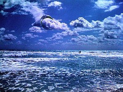 Here's a select bunch of images from the snap-happy crowd at Flikr.com, featuring beach kites, clouds and general kite-surfing action!