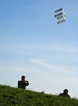 A traditional box kite in flight.