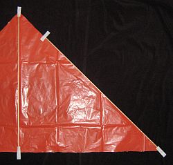 The Simple Delta - taping the spars to the sail - 1