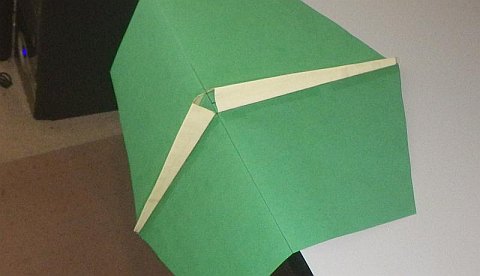 The Paper Rokkaku kite - lower piece (on table) taped on and shaped.