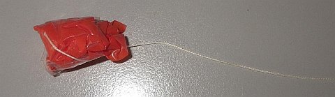 The Parachute kite - square piece of plastic scrunched up and attached to line with tape.