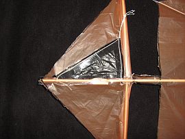 The 1-Skewer Roller - taping keel to lower sail.