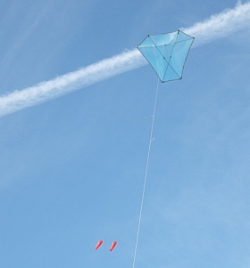 The MBK Multi-Dowel Barn Door kite in flight, trailing twin drogues. The MBK Multi-Dowel Barn Door kite in flight, trailing twin drogues.