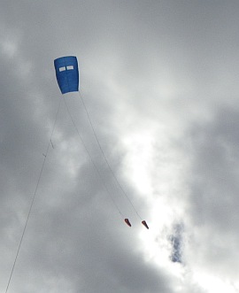 The MBK Fresh Wind Sled kite in flight with twin drogues. The MBK Fresh Wind Sled kite in flight with twin drogues.