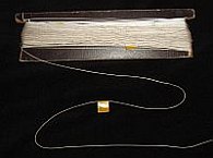 Kite parts - kite line on a wooden winder. Kite parts - kite line on a wooden winder.