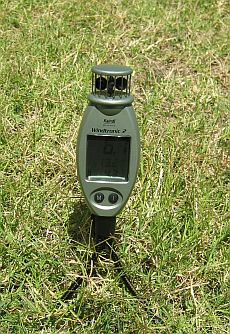 Kiting wind meter - the Kaindl Windtronic 2 on a grass lawn Kiting wind meter - the Kaindl Windtronic 2 on a grass lawn
