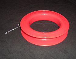 A circular plastic reel for storing line. A circular plastic reel for storing line.