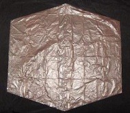 The Dowel Rokkaku - sail cut out and edged with sticky tape. The Dowel Rokkaku - sail cut out and edged with sticky tape.