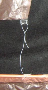 The Dowel Roller - close-up of sail corner tie