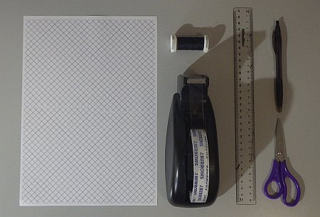 Origami kite materials and tools.