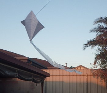An origami kite in flight.