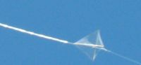 Early clear plastic 1-Skewer Diamond kite in flight.