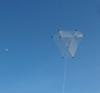 The MBK Barn Door Kite in flight next to the moon